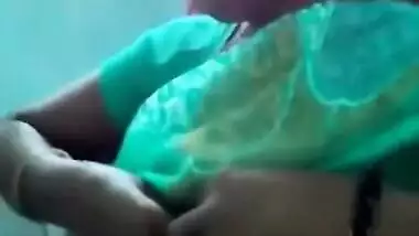 Horny Indian female un green helps man relax touching her XXX boobs