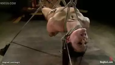 Brunette in suspension throat fucked