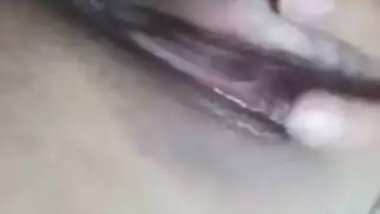 Risque Indian babe takes breasts and pussy out in a short porn video