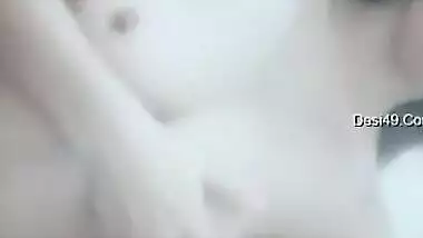 Cute Desi girl gives air kisses posing XXX topless in the bathroom